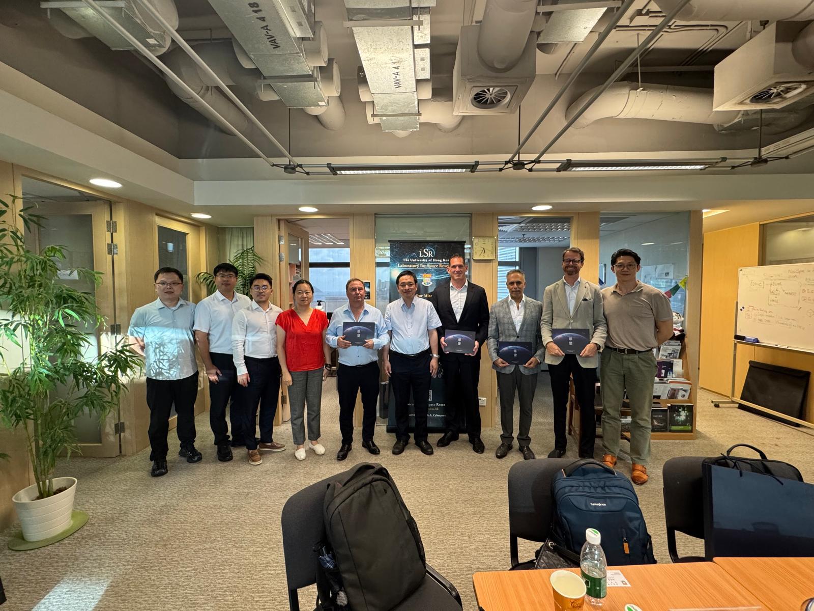 Black and white photo of a women performing modern dance on a dark background.